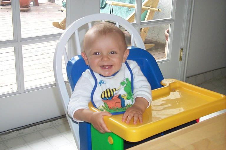 Asten_in_high_chair_7-17-99_1