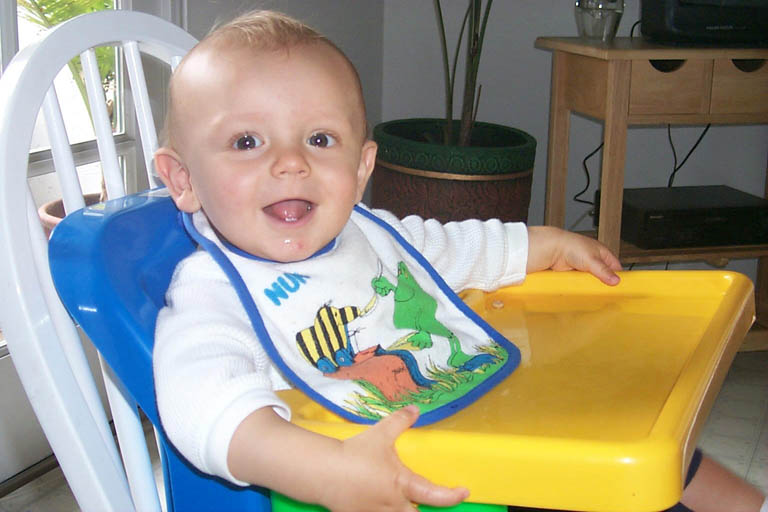 Asten_in_high_chair_7-17-99_2