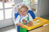 Asten_in_high_chair_7-17-99_1