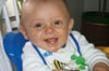 Asten_in_high_chair_7-17-99_3
